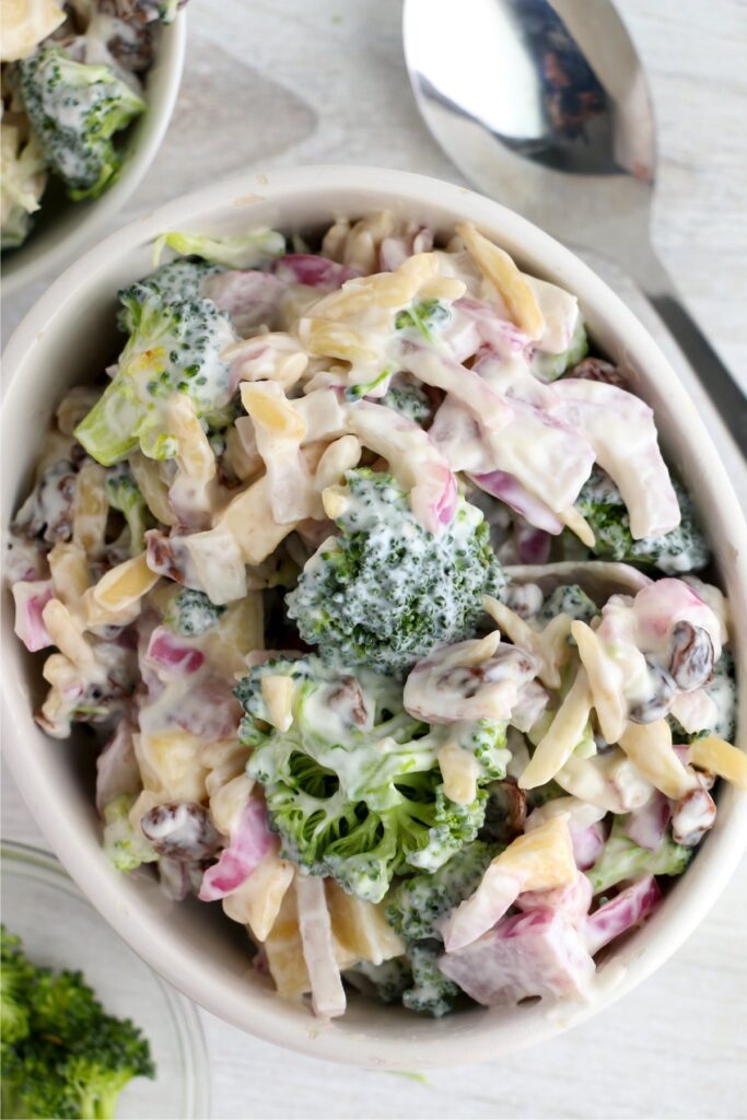 Overhead shot of creamy broccoli salad in bowl