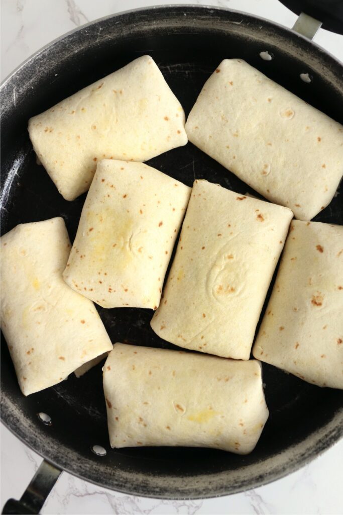 Overhead shot of chicken salad wraps in pan