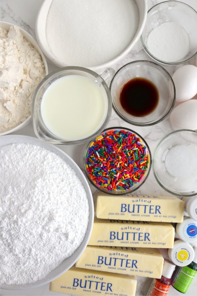 Overhead shot of individual cake and frosting ingredients on table