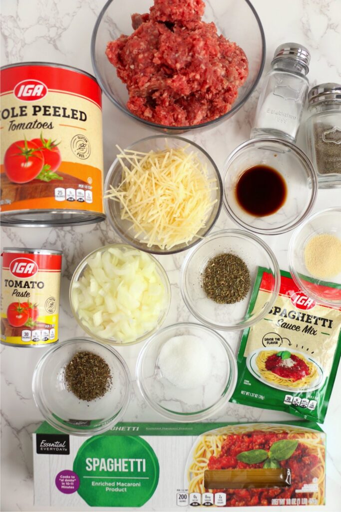 Overhead shot of spaghetti ingredients in bowls on table