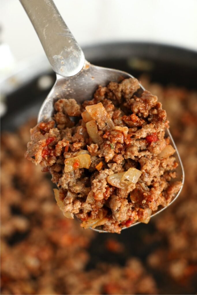 Closeup shot of cooked beef in spoon