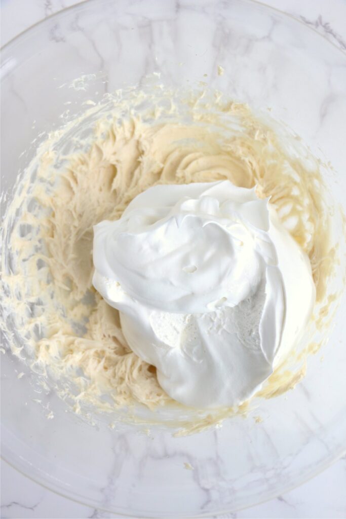 Overhead shot of Cool Whip with cream cheese mixture in bowl