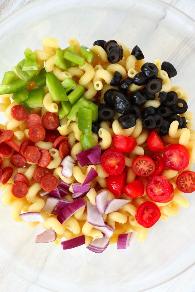 Overhead shot of summer pasta salad ingredients in bowl