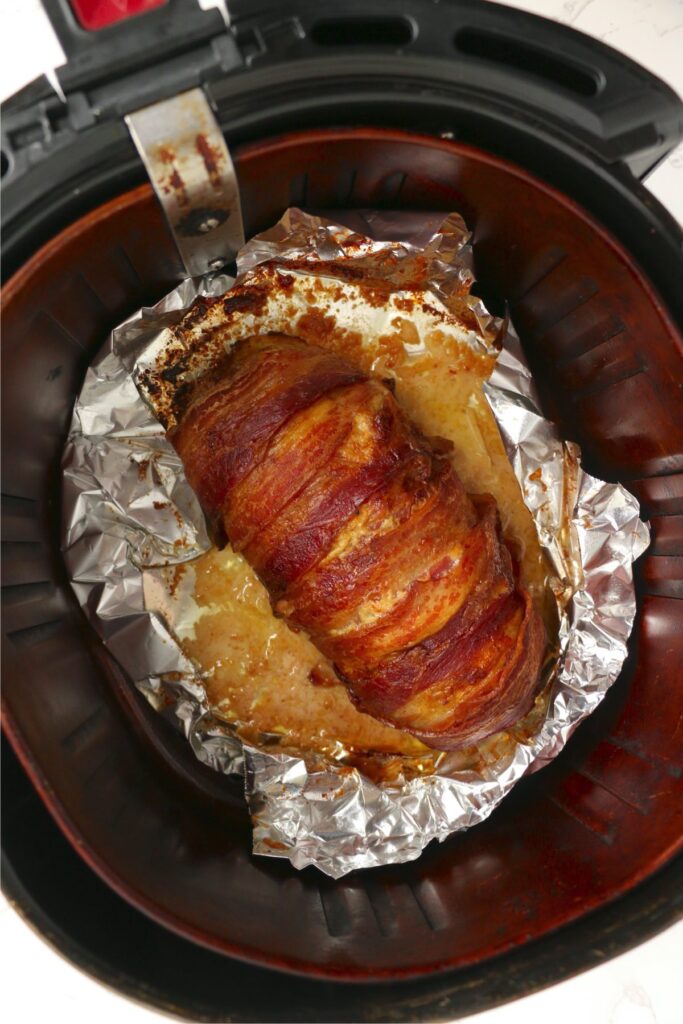 Overheat shot of cooked turkey meatloaf in air fryer basket