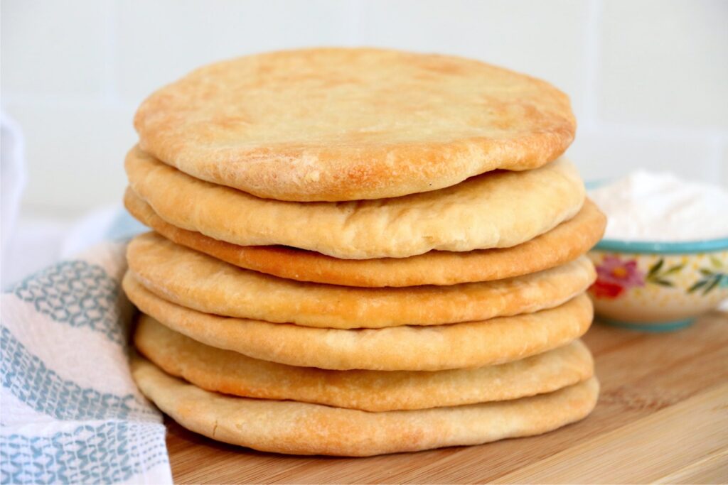 Stack of air fryer flatbread on cutting board