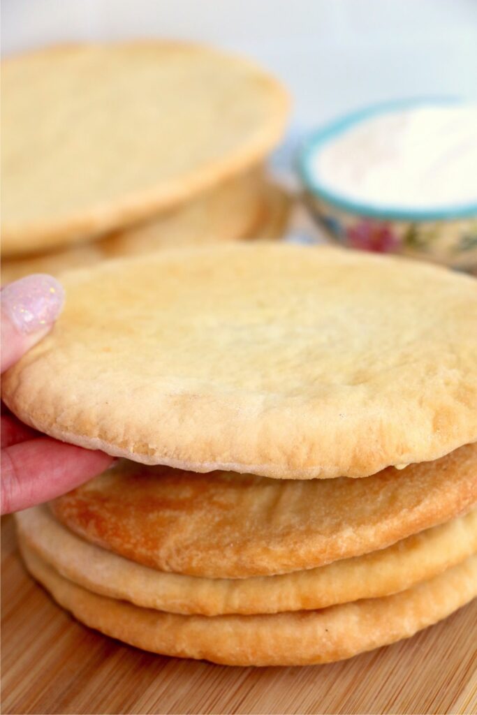 Closeup shot of stack of air fryer flatbread on cutting board