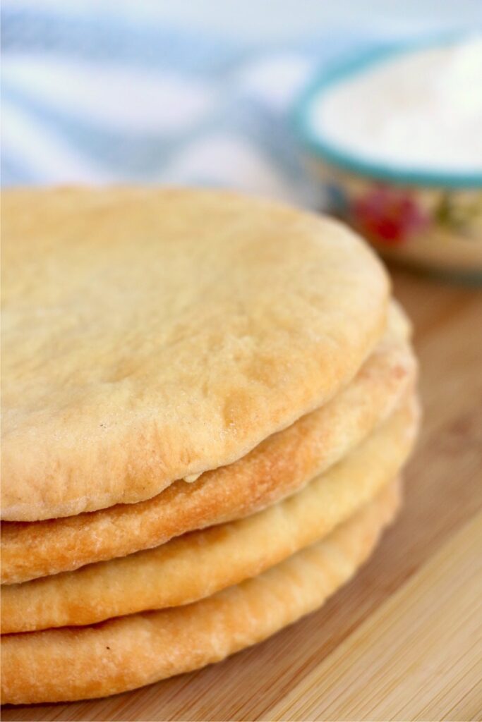 Closeup shot of stack of air fryer flatbread on cutting board