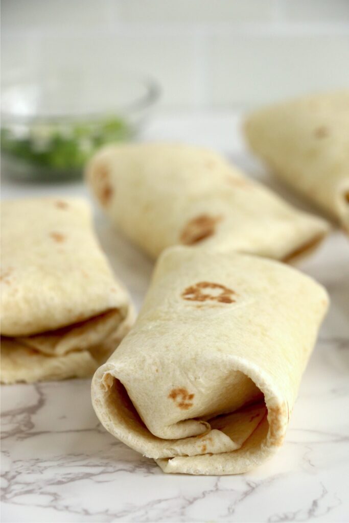 Closeup shot of Buffalo chicken wraps on table