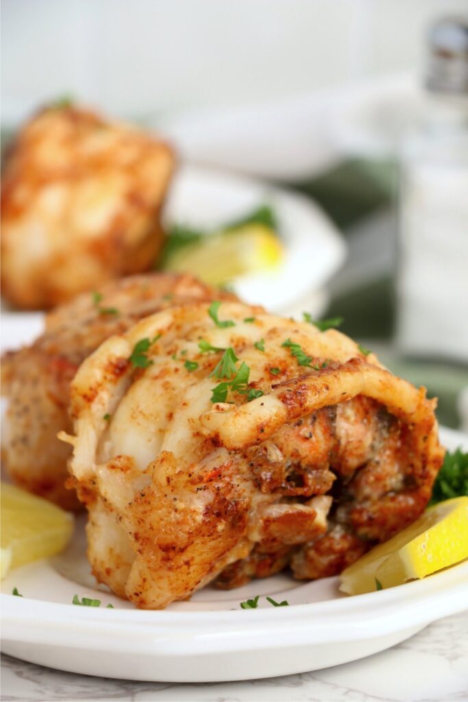 Closeup shot of butter poached lobster tail on plate