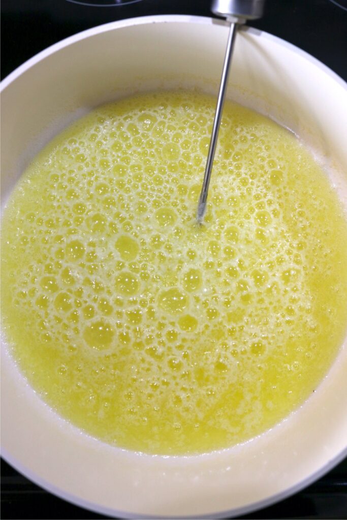 Overhead shot of water and butter mixture in pot