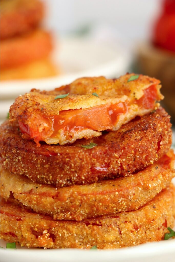 Closeup shot of fried red tomatoes stacked atop one another