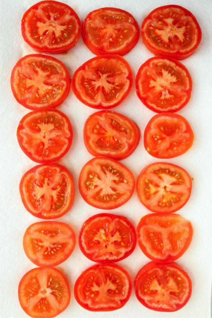 Overhead shot of sliced red tomatoes