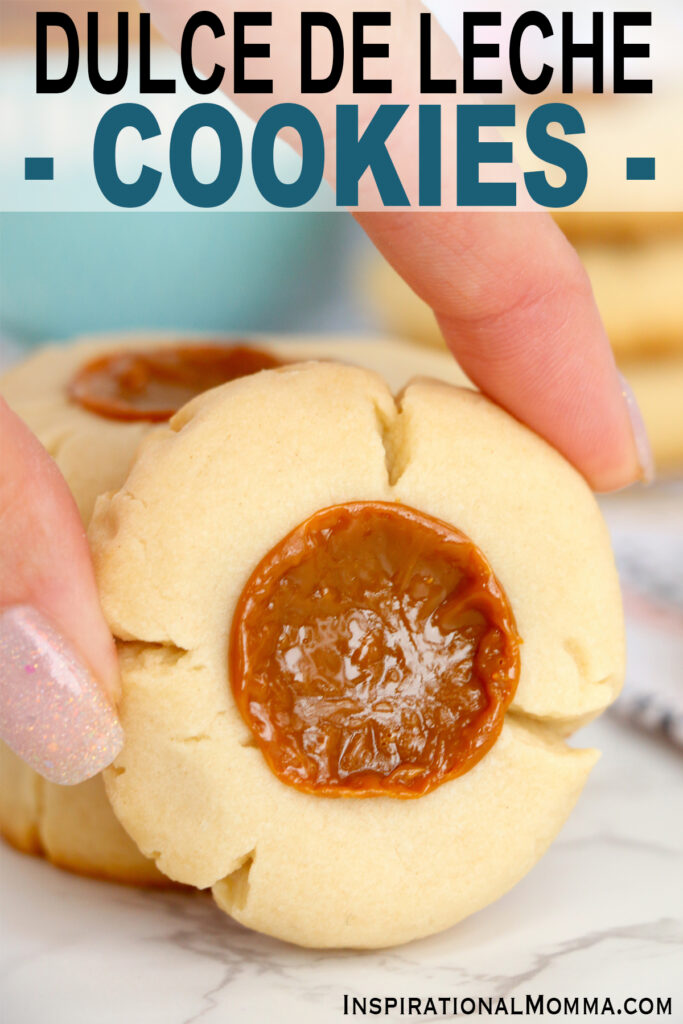 Closeup shot of hand holding a dulce de leche cookie