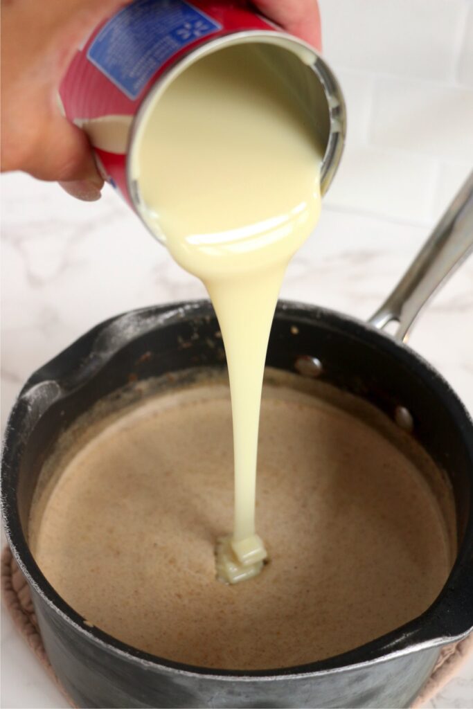 Ading condensed milk to other ingredients in pot