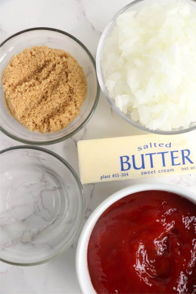 Overhead shot of individual onion ketchup ingredients on table