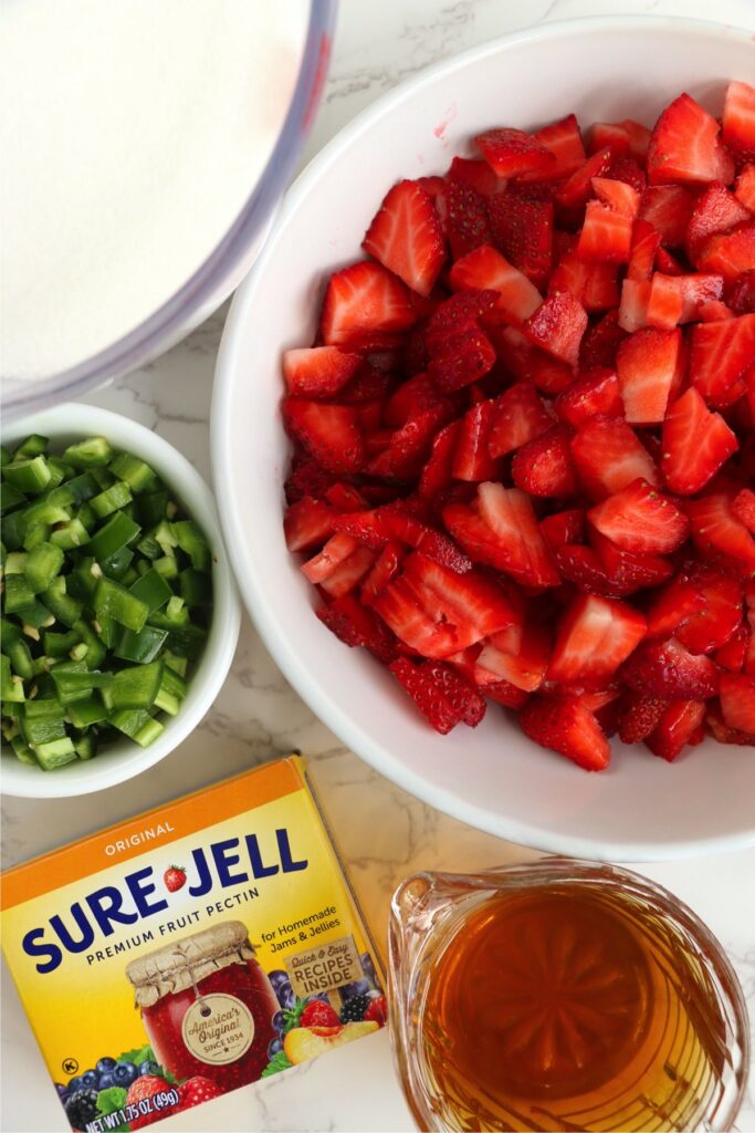 Overhead shot of jam ingredients in individual bowls