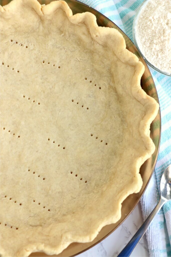 Overehead shot of baked pie crust in pie plate