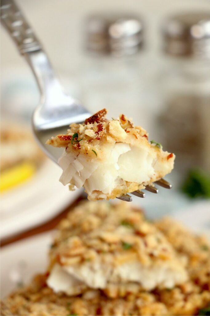 Closeup shot of forkful of almond crusted walleye