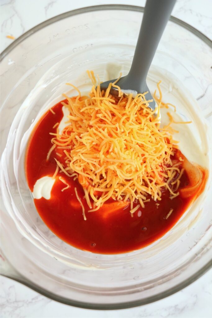 Overhead shot of Buffalo chicken dip ingredients in bowl