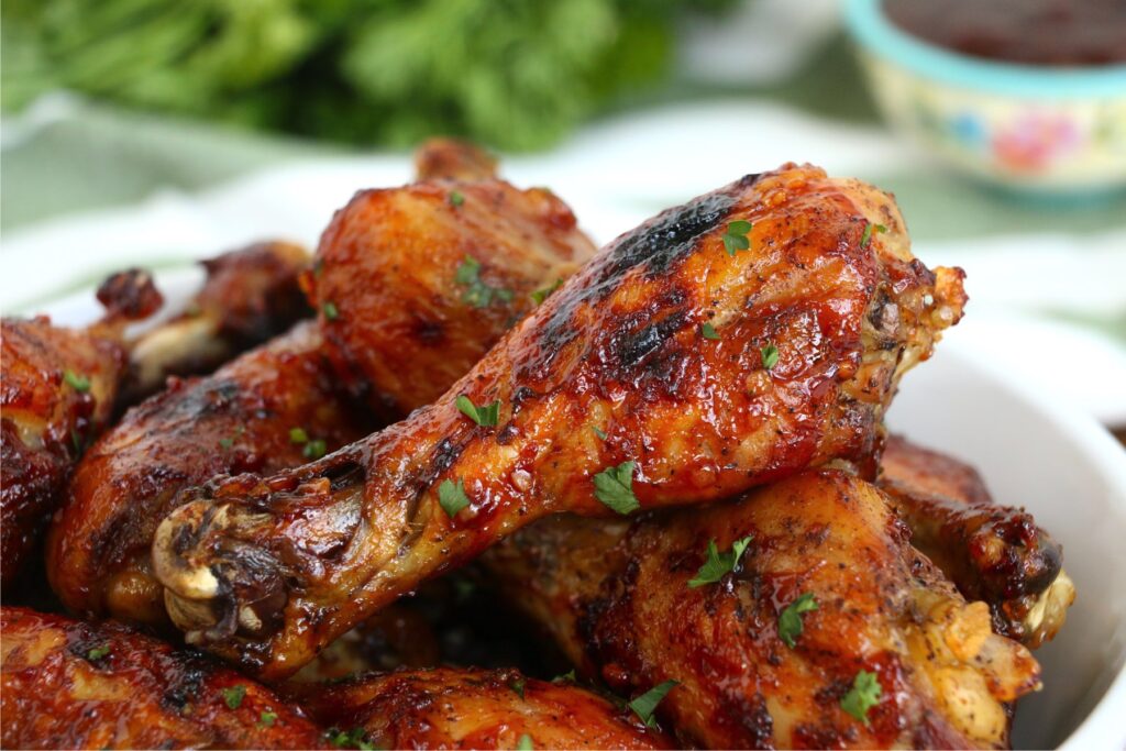 Closup shot of crock pot bbq chicken drumsticks on plate