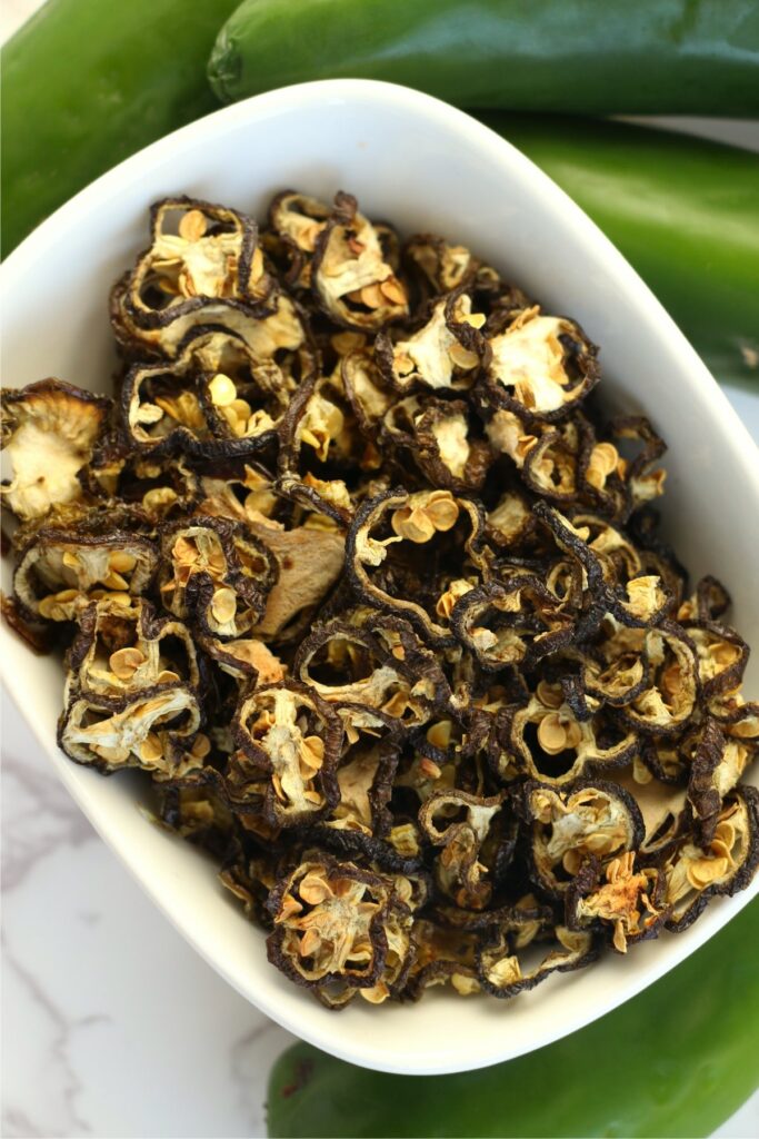 Overhead shot of bowlful of dried jalapenos