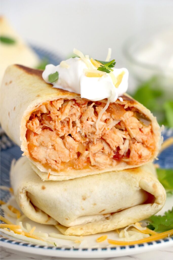 Closeup shot of chicken salsa wraps stacked atop one another on plate