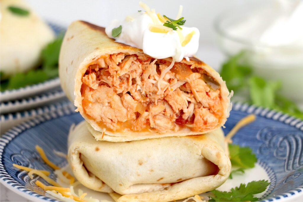 Closeup shot of two chicken salsa wraps stacked atop one another.