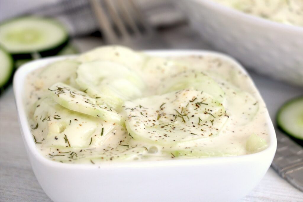 Closeup shot of bowlful of cucumber salad.