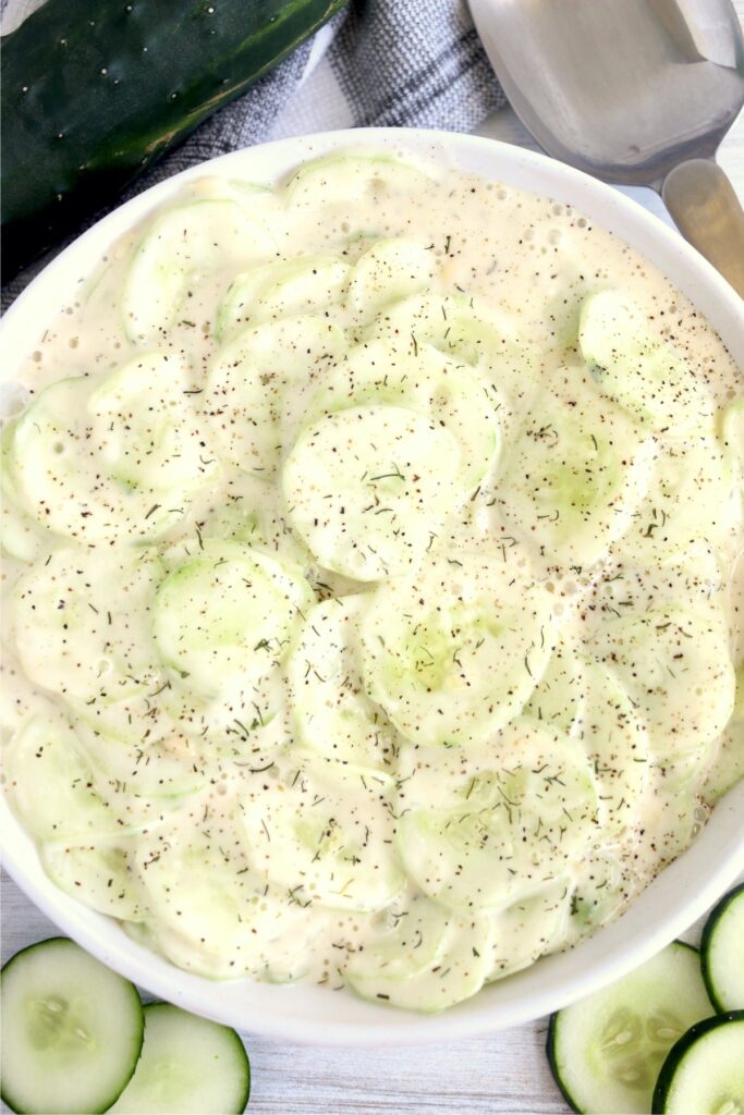 Overhead shot of bowlful of creamy cucumber salad with Miracle Whip