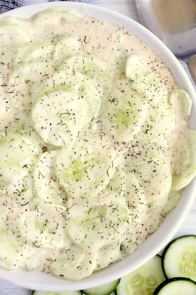Overhead shot of bowlful of creamy cucumber salad with Miracle Whip
