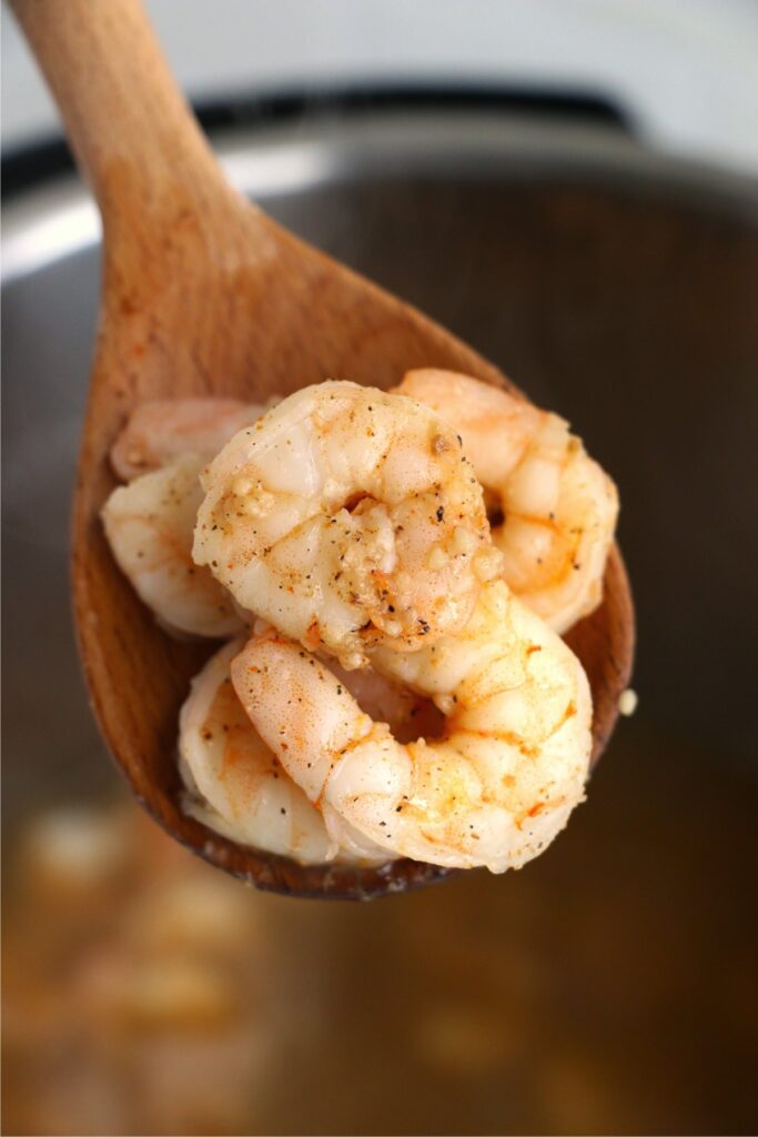 Closeup shot of spoonful of cooked instant pot shrimp