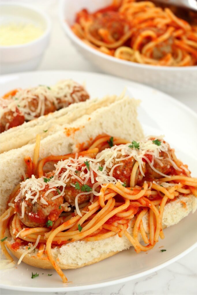 Two spaghetti stuffed subs on plate