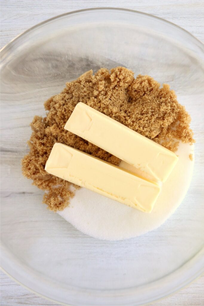 Overhed shot of butter, sugar, and brown sugar in mixing bowl