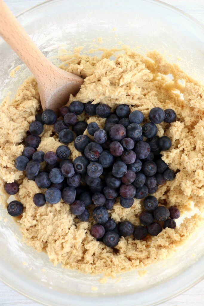 Overhead shoth of blueberries and cookie dough in bowl