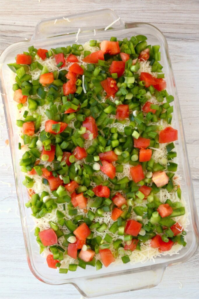 Overhead shot of completed seafood cheese dip in baking dish