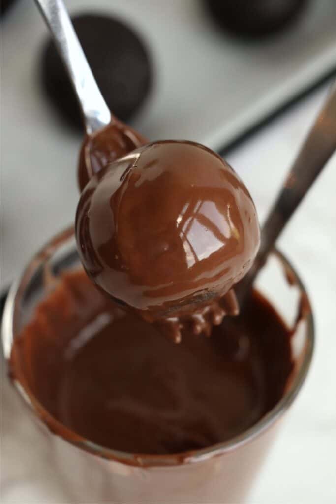 Closeup overhead shot of chocolate coated cake ball on fork