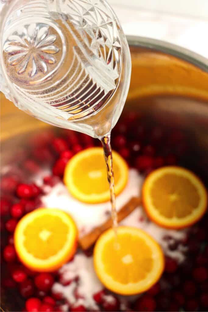 Overhead shot of cranberry sauce ingredients in instant pot.