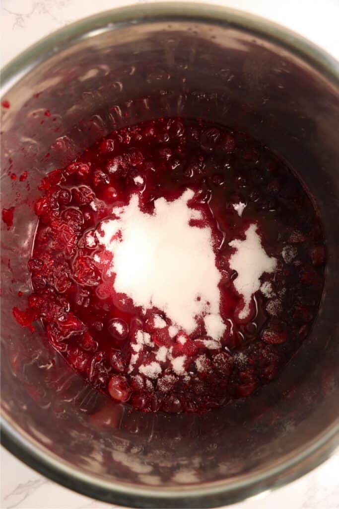 Overhead shot of sugar and craberry sauce in Instant Pot