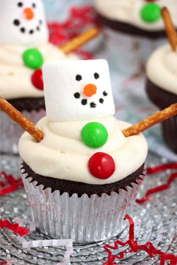 Closeup shot of chocolate snowman cupcakes on serivng plate