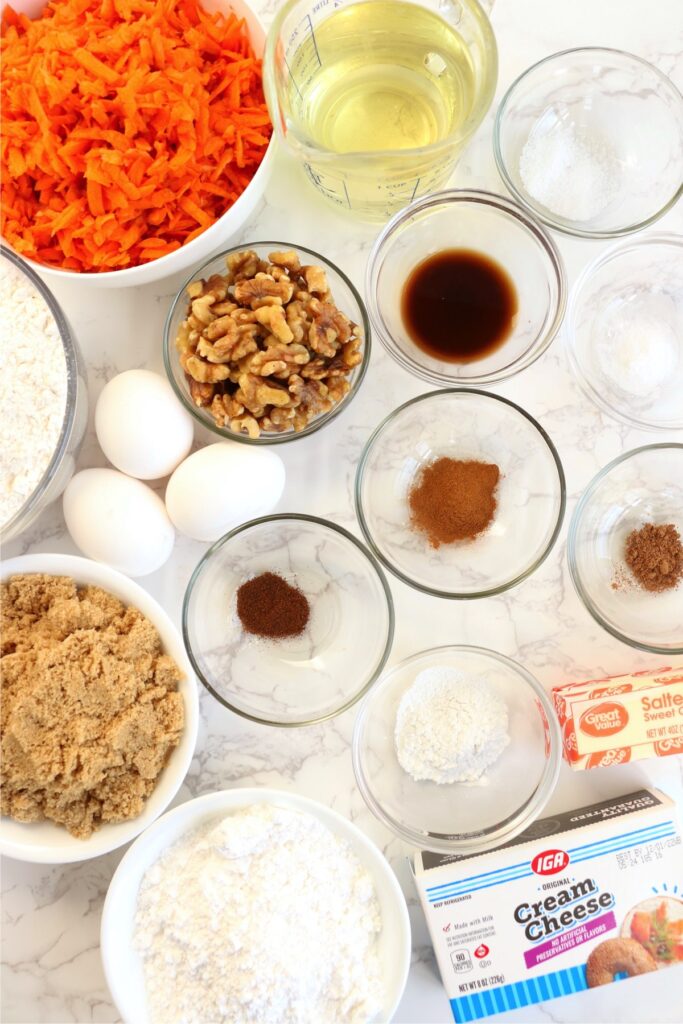 Overhead shot of individual air fryer carrot cake ingredients in bowls on table