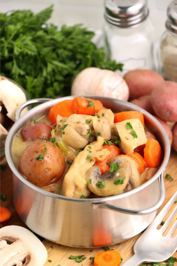 Chickent thigh stew in pot on table