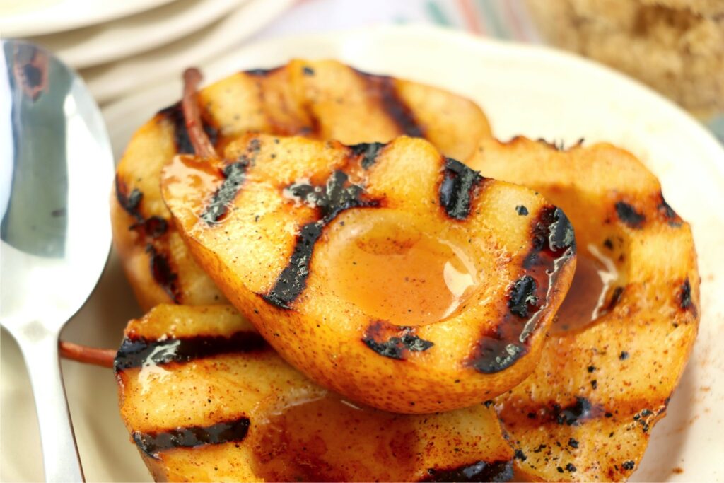 Closeup shot of grilled pears on plate.