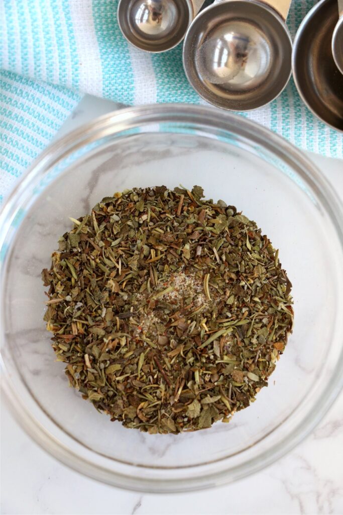 Overhead meatloaf seasoning in mixing bowl