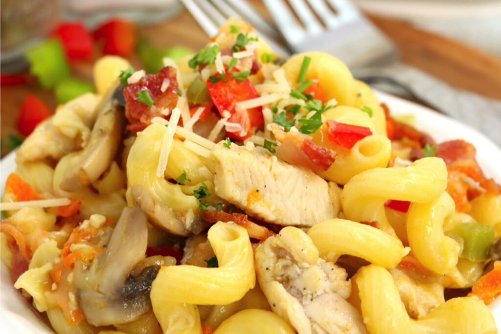 Closeup shot of rigatoni carbonara on plate.