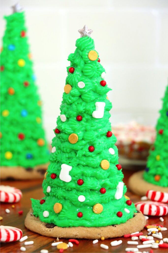 Closeup shot of sugar cone Christmas tree surrounded by peppermint candies