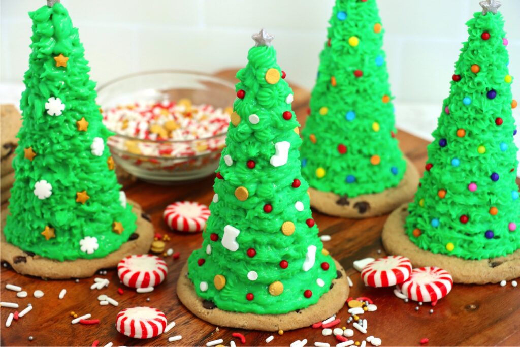 Sugar cone Christmas trees surrounded by peppermint candies on table