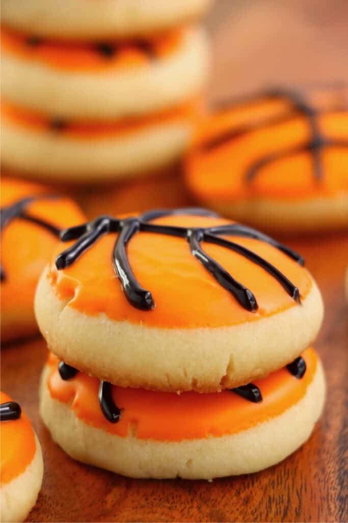Closeup shot of two basketball sugar cookies stacked atop one another.