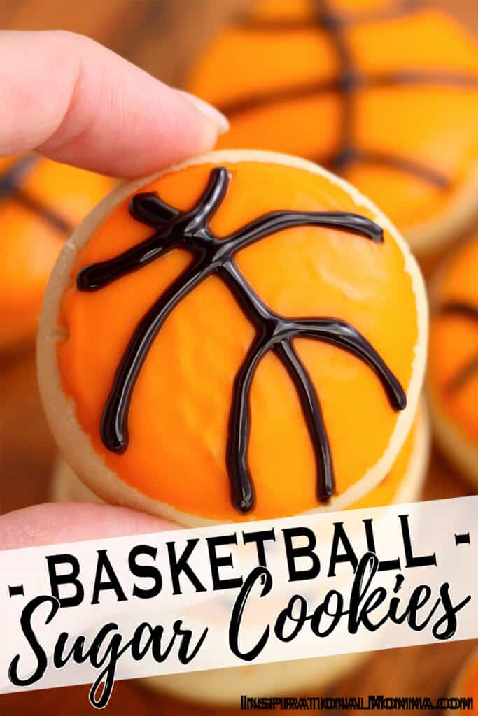 Closeup shot of hand holding basketball sugar cookie