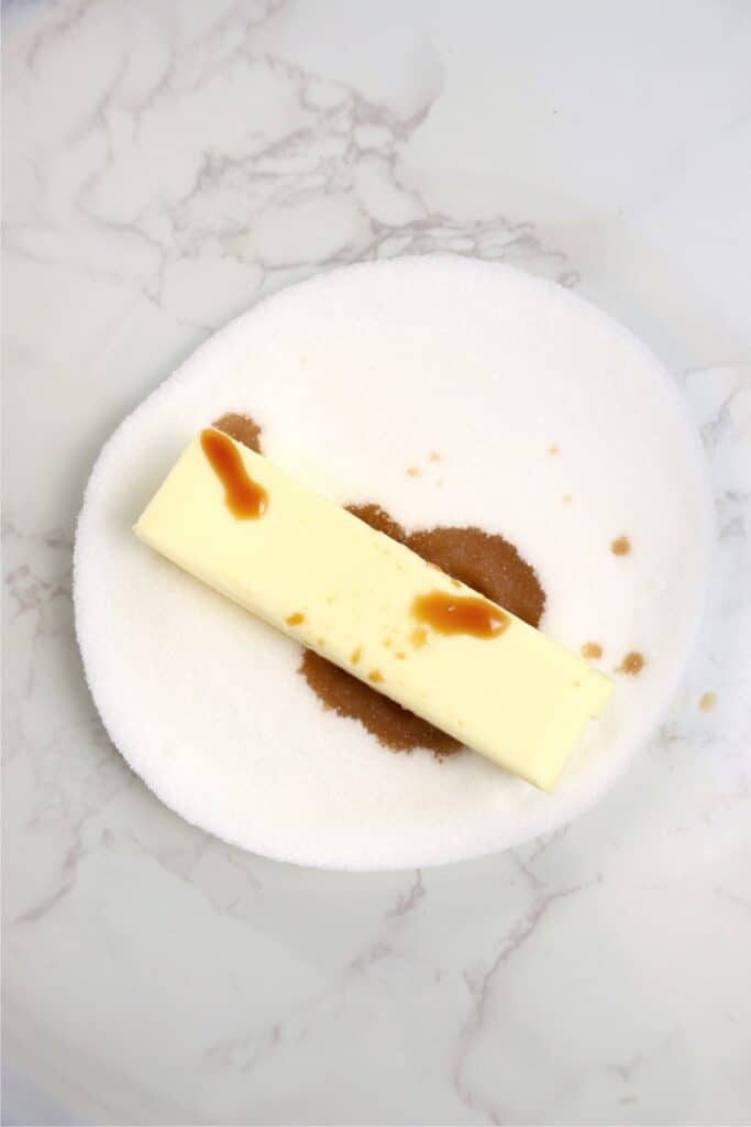 Overhead shot of sugar, butter, and vanilla in bowl