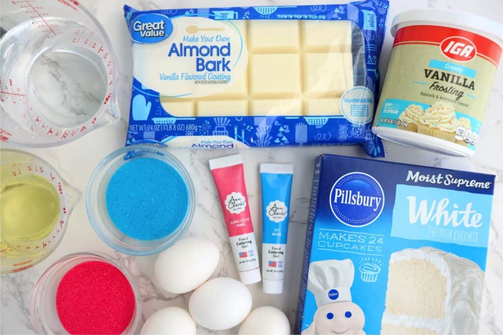 Overhead shot of gender reveal cake pop ingredients on table